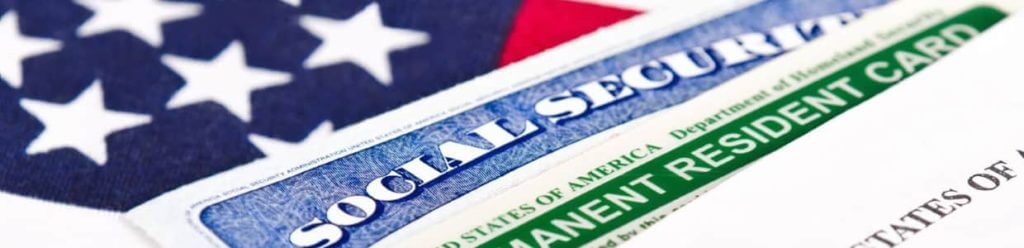 green card, american flag and other documents